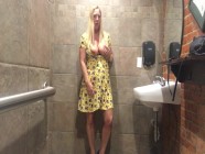 Horny MILF vibrates pussy in bar restroom!