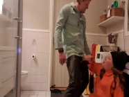 Sucking and wanking big dick in the bathroom in oily rainwear and rubber boots