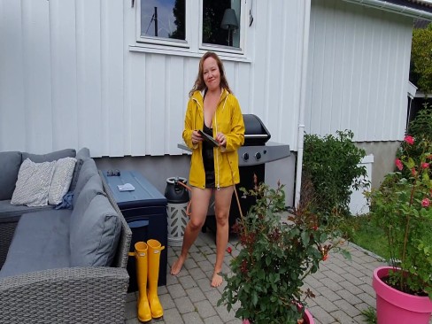 Getting dressed in latex dress, stay ups, raincoat and rubber boots at porn.se